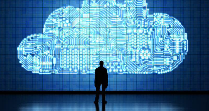 Person standing in front of artistic representation of cloud computing.