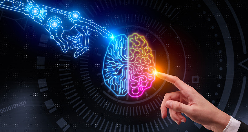 Digital and human hands pointing at a glowing digital brain. 