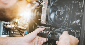 Person upgrading computer hardware components.
