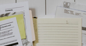 Stack of legal forms spread out on a table.